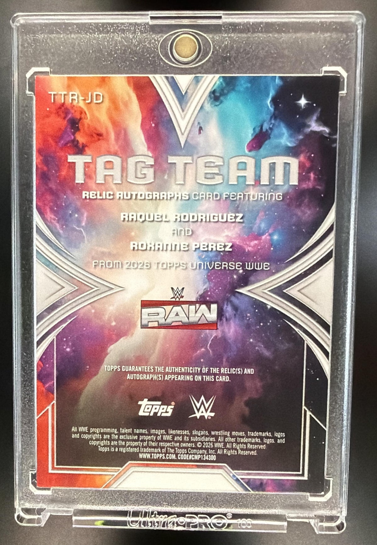 2026 Topps Universe WWE Roxanne Perez Raquel Rodriguez #TTR-JD Tag Team Relic Auto Orange Warp /25