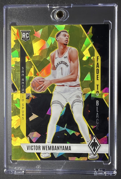2023-24 Panini Phoenix Victor Wembanyama #11 Fade To Black Yellow Ice 137/175 RC